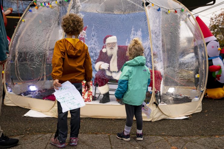 Santa Greets Children From Safety Of Socially-Distanced Bubble