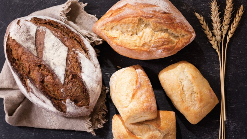 Artisan bread loaves on display, symbolizing Associated British Foods strategic merger challenge to Warburtons in the brea...