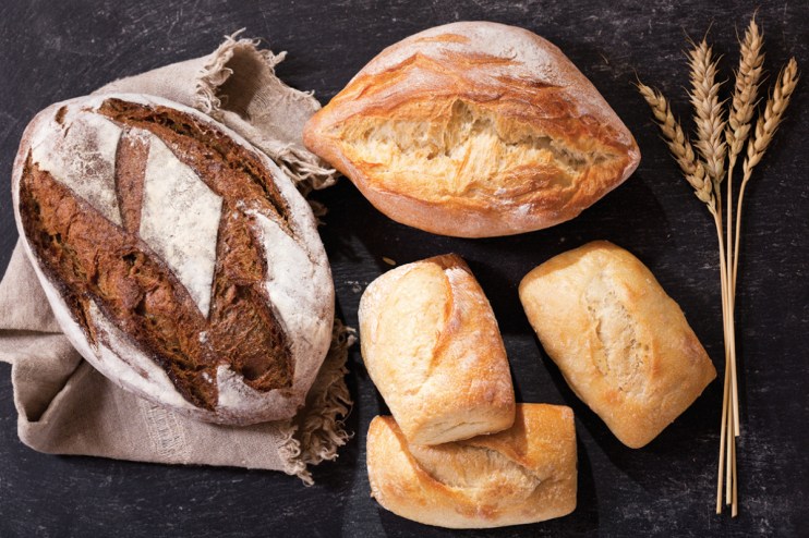 Artisan bread loaves on display, symbolizing Associated British Foods strategic merger challenge to Warburtons in the brea...