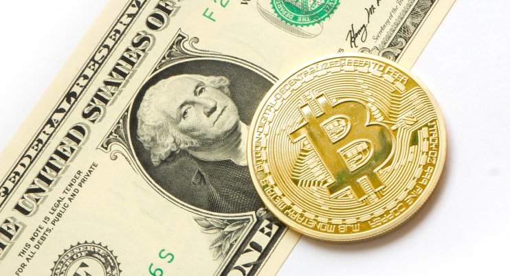Bitcoin on a dollar bill - Image by Tom Bark from Pixabay
