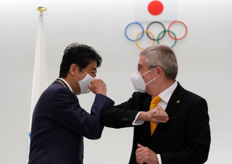 The IOC vaccine offer, announced by president Thomas Bach (right), may ease concerns in Japan about the planned influx of visitors for this summer's Tokyo 2020 Olympics