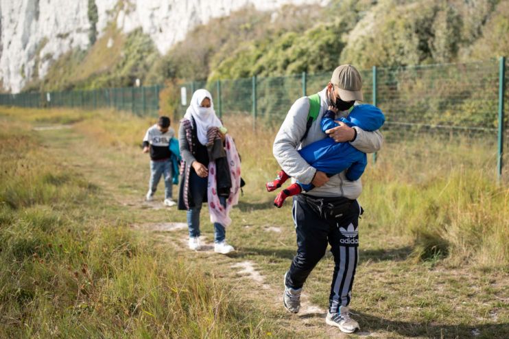 Migrants With Children Arrive On Kent Beach After Crossing Channel