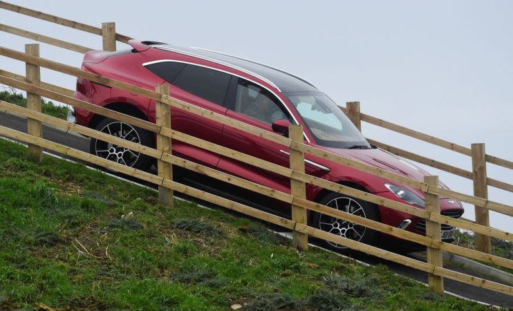 Aston Martin plunged to yet another loss this morning despite selling more than three times the number of cars it did in the first half last year.