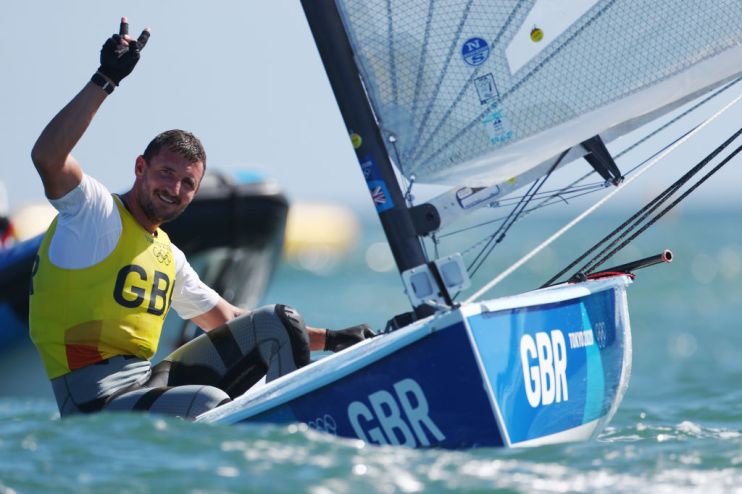 Giles Scott defended his Finn title as Team GB celebrated two gold medals in sailing at the Tokyo 2020 Olympics this morning