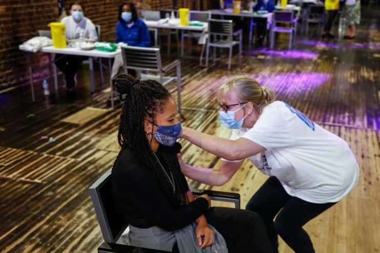 Women receives Pfizer vaccine