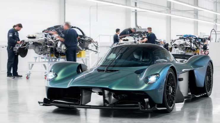 A couple of ex Aston Martin dealers have launched a &pound;150m lawsuit against the luxury car maker over the underwriting of the Valkyrie model.