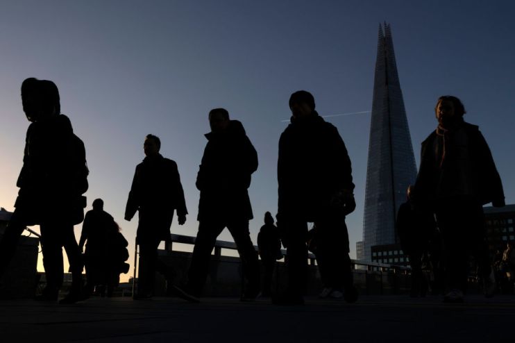 Commuters walking over London Bridge