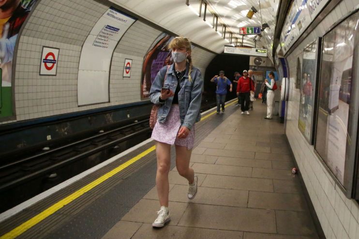 A woman seen wearing a face mask as a precaution against the