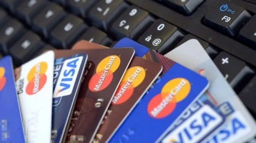 Credit checker Experian has posted an upswing in growth and held its forecast for the full year after seeing a 21m rise in customers.