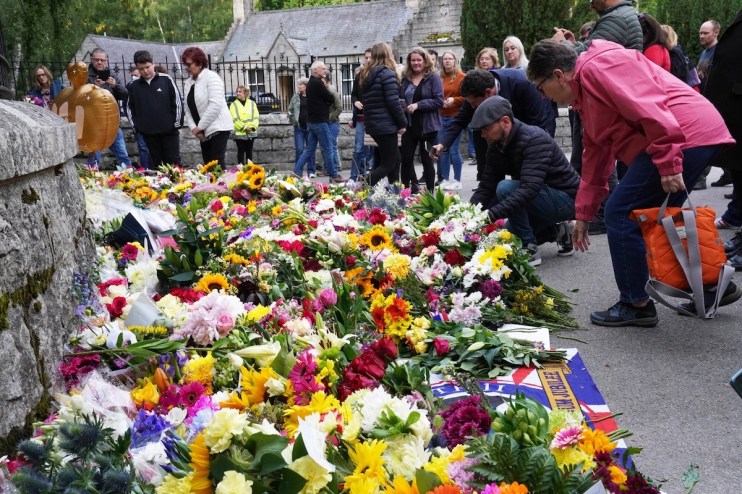 Floral tributes are laid at the gates of Balmoral in Scotland following the death of Queen Elizabeth II on Thursday. Picture date: Friday September 9, 2022.