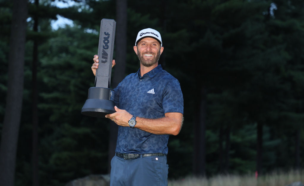 Dustin Johnson of the the United States holds the winner's trophy after winning the LIV Golf Invitational - Boston at The Oaks golf course at The International on September 04, 2022 in Bolton, Massachusetts.