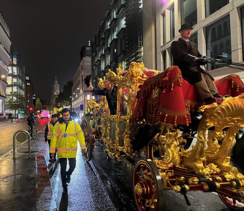 Horse-drawn golden state carriage in the heart of the City 
