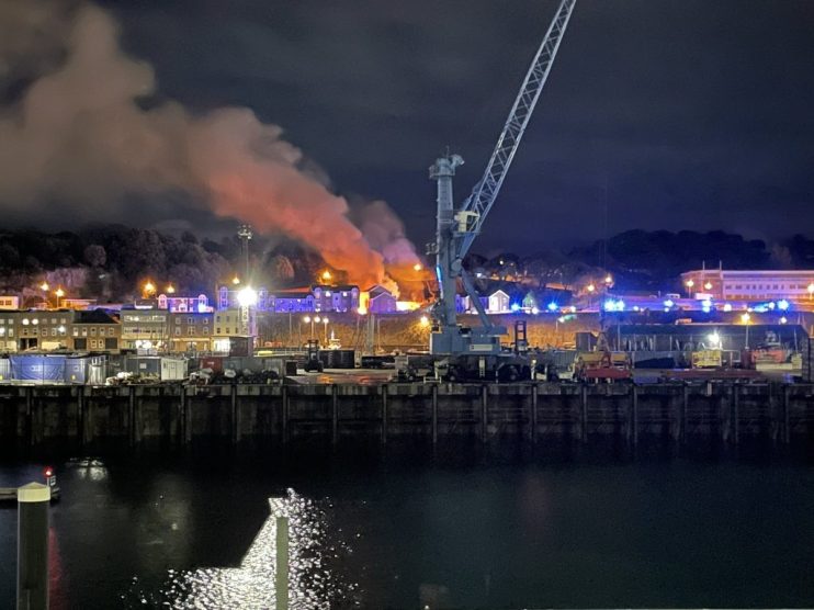 One person has died and several are missing following an explosion and fire at a block of flats in Jersey, police have said.