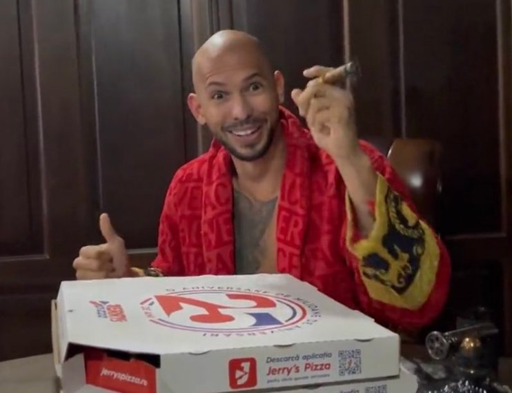 Andrew Tate posted a picture on social media, with the pizza box in the foreground giving his location away. (Twitter)
