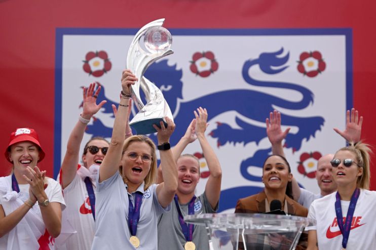 The Lionesses Lift The UEFA Women's Euro Trophy In Victory Celebration For Fans