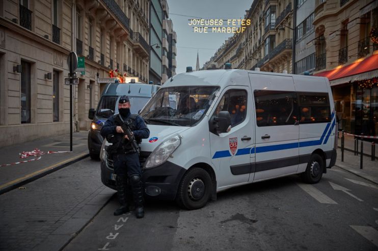 An armed French Policeman stands guard to a blocked off street (Photo by Kiran Ridley/Getty Images)