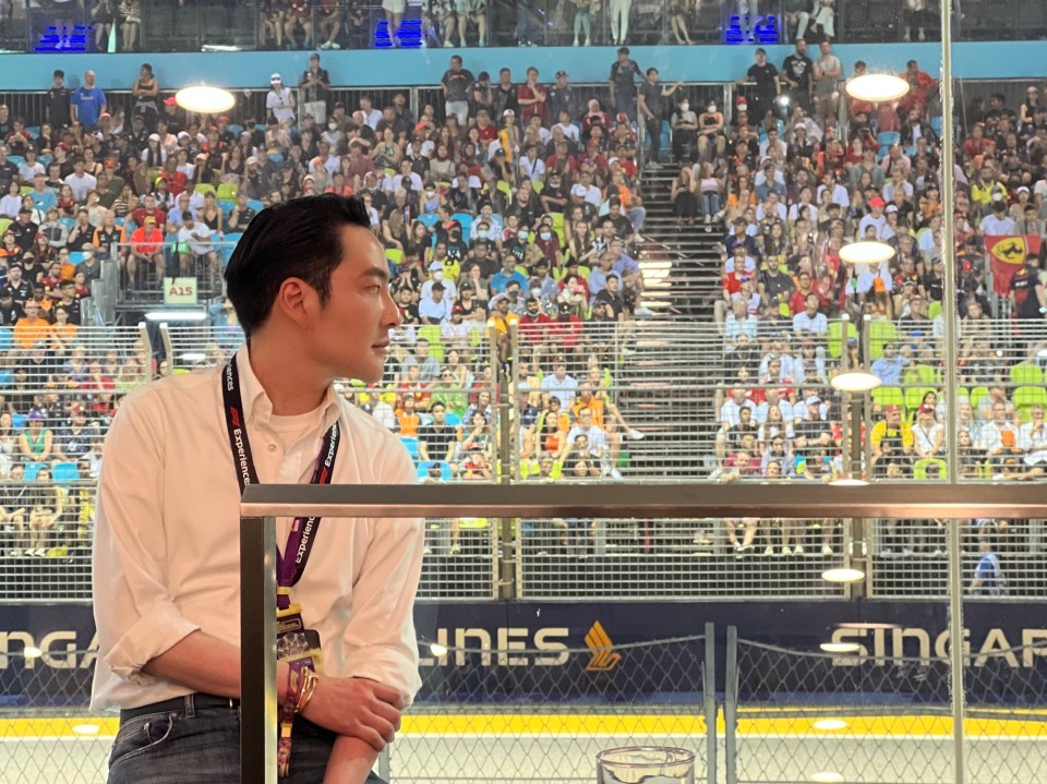 Calvin Lo on the pitwall of an Formula 1 track