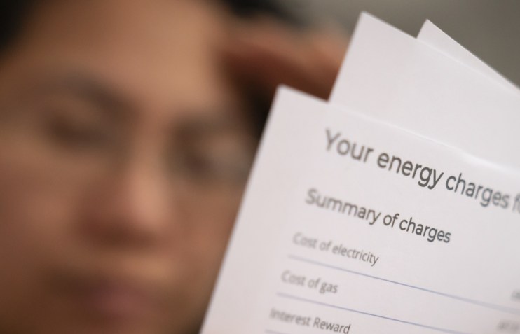 Person holding an energy bill.
