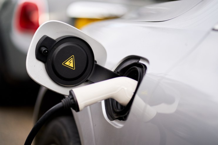 A car being charged using a Ubitricity lampost EV charging point