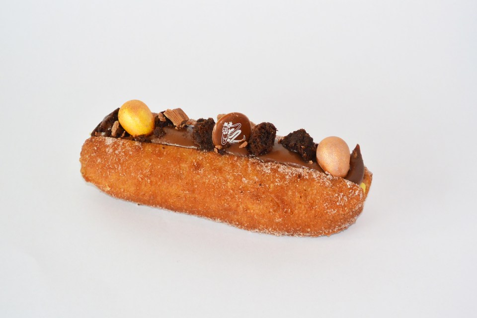 Donut-shaped chocolate Easter egg with vibrant sprinkles, reviewed in City guide for must-have 2023 Easter treats