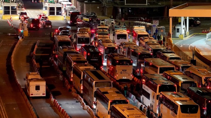 Coaches wait in to the evening to enter the Port of Dover in Kent after extra sailings were run overnight to try and clear the backlog which has left passengers stuck in Easter traffic for hours.
