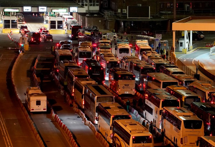 Coaches wait in to the evening to enter the Port of Dover in Kent after extra sailings were run overnight to try and clear the backlog which has left passengers stuck in Easter traffic for hours.