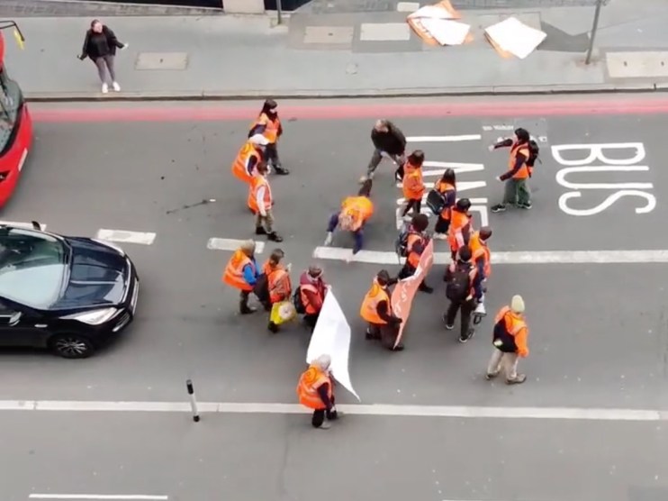 The moment a Just Stop Oil demonstrator was thrown to the ground during a slow match in Canada