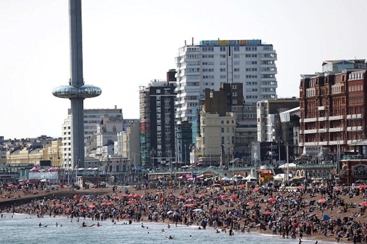 BRIGHTON, ENGLAND &ndash; MAY 28: People enjoy the warm weather at Brighton beach on May 28, 2023 in Brighton, England. The UK is set to experience the hottest days of the year over the Bank Holiday weekend, with balmy temperatures expected into parts of next week. (Photo by Hollie Adams/Getty Images)