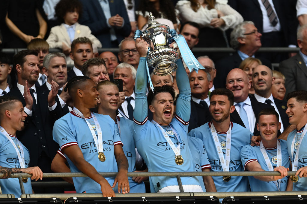 As the result of a match where a trophy was up for grabs turned Manchester blue yet again, City went within one win of an iconic treble – something English football has not seen since United’s feat in 1998-1999. So with their 2-1 FA Cup final win over United leaving Pep Guardiola’s side two thirds of the way on the road to history, how does their treble attempt stack up to United’s from 24 years ago.