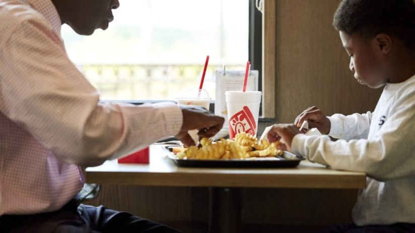 Two guests dining in at a Chick-fil-A restaurant