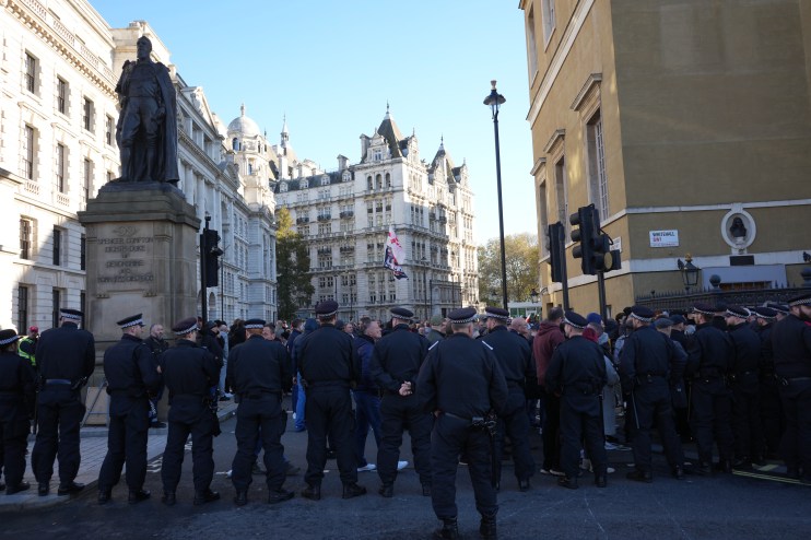 Police officers take their positions by the Cenotaph in Whitehall, central London, ahead of a pro-Palestinian protest march which is taking place from Hyde Park to the US embassy in Vauxhall