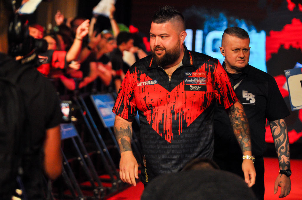 Reigning World Darts Championship winner Michael Smith will start his title defence against either Kevin Doets or Stowe Buntz following yesterday's draw for the iconic Alexandra Palace tournament.