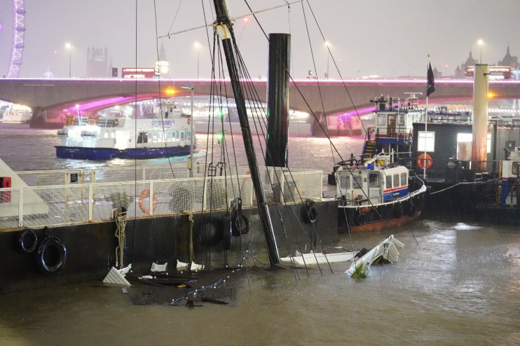 The mast of the Bar & Co boat, which was moored at Temple Pier juts from the water after the London party boat which acts as a floating bar, restaurant and nightclub sunk in the River Thames. Photo credit should read: James Manning/PA Wire
