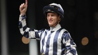 Zac Purton riding in national colors at Happy Valley during the eight-runner race symbolizing World Cup quarter-finalists.