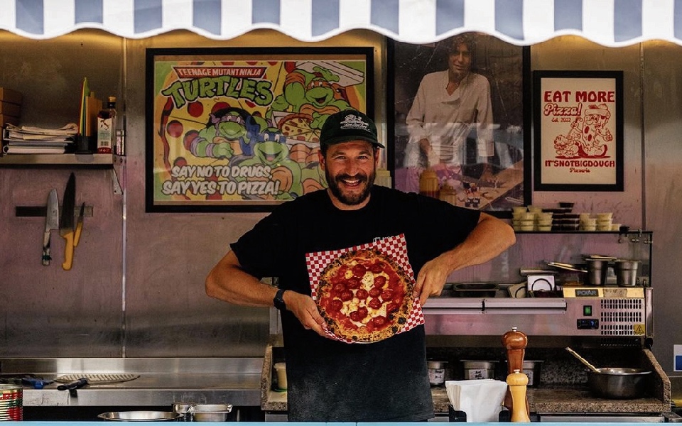 Nick Ingham, owner of It&rsquo;s Not Big Dough, makes pizza from a container in Blackhorse Road