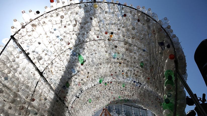 SAN FRANCISCO, CA - MARCH 22: Merijn Everaarts makes adjustments to a 14-foot wave made of plastic bottles on March 22, 2013 in San Francisco, California. The Dopper Foundation marked United Nations' World Water Day by inviting people to have their photo taken while standing on a surfboard on a 14-foot wave comprised of 6,000 single-use water bottles. The installation is intended to raise awareness to reduce plastic waste that litters oceans and waterways. (Photo by Justin Sullivan/Getty Images)