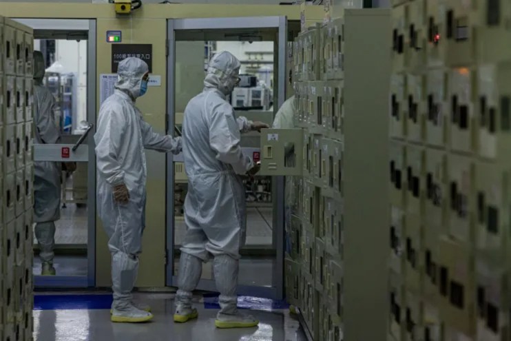 ASML designs and builds the systems and software used in the production of microchips, which are essential for data centres. (Photo by Annabelle Chih/Getty Images)