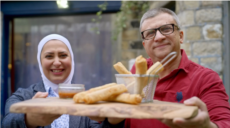 Razan Alsous and her husband Raghid Sandouk of Yorkshire Dama Cheese holding their famous 'Hello-Mi' rolls.