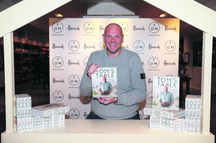 LONDON, ENGLAND - SEPTEMBER 23: Chef Tom Kerridge poses with a copy of his book "Tom's Table: My Favourite Recipes" a Bloomsbury title at Harrods on September 23, 2015 in London, England. (Photo by Chris Jackson/Getty Images)
