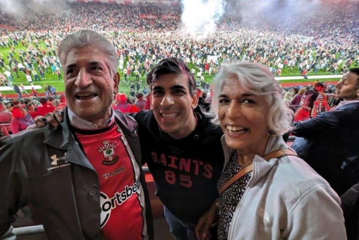 Rishi Sunak with parents at football match