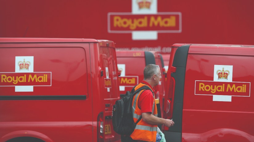 Royal Mail delivery van outside a postal depot, representing the &pound;21m fine by Ofcom for late mail deliveries.