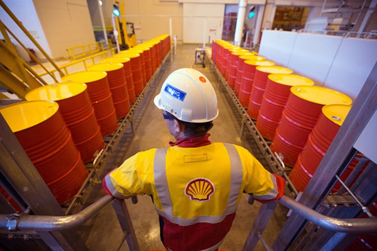 Shell CEO Wael Sawan in a boardroom setting, highlighting his reported &pound;4.5m pay boost under new remuneration policy.