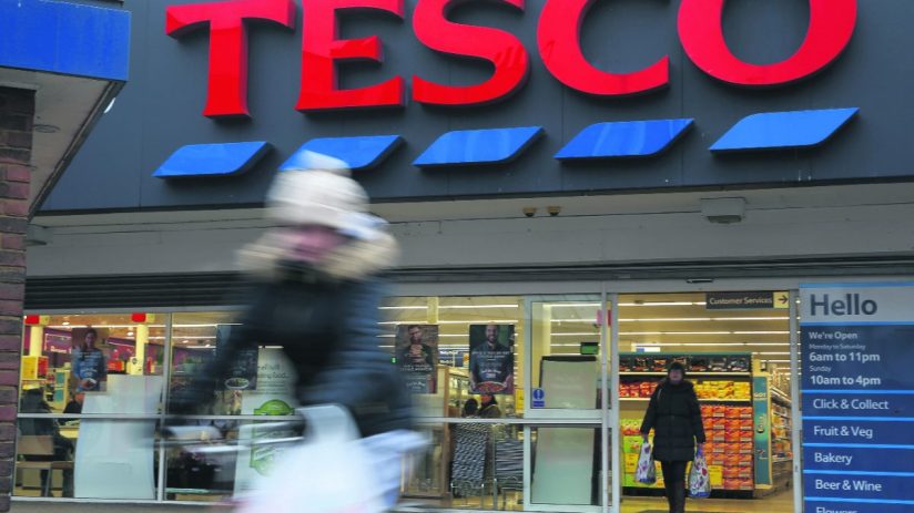 Tesco store exterior with festive decorations, highlighting its 10-year UK market share high and Q3 sales performance.