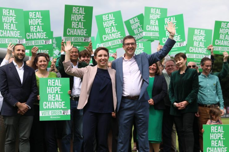 BRIGHTON, ENGLAND - JUNE 12: Co-leaders of the Green Party Carla Denyer (Centre L) and Adrian Ramsay (Centre R) pose with supporters after The Green Party Manifesto launch on June 12, 2024 in Brighton, England. The Green Party Manifesto is launched today by co-leaders, Carla Denyer, the Green Party candidate for Bristol Central, and Adrian Ramsay, the Green Party candidate for Waveney Valley. Also attending is the Green Party member Sian Berry, candidate for Brighton Pavilion campaigning for the 4th July general election.(Photo by Alishia Abodunde/Getty Images)