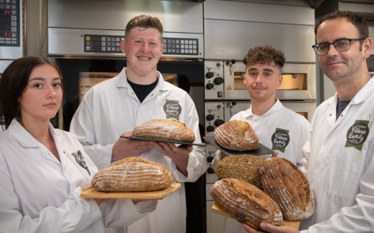 A French bread maker has purchased a controlling stake in Village Bakery.