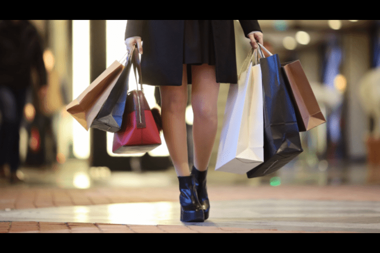 Burberry has cut its dividend after a plunge in sales.