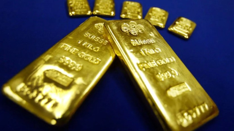 Gold bars stacked in a vault, highlighting record high investor demand amid geopolitical uncertainty in 2025.