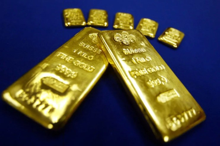Gold bars stacked in a vault, highlighting record high investor demand amid geopolitical uncertainty in 2025.