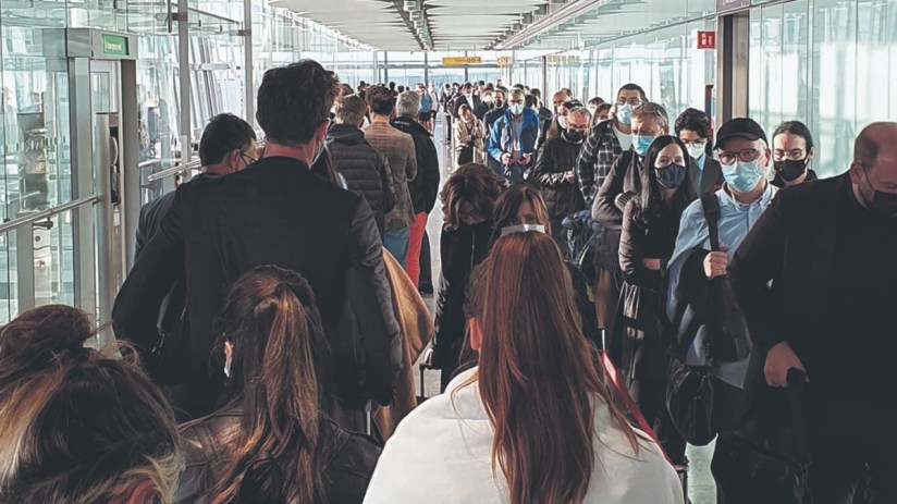 Passengers queue for the Arrival Hall at London Heathrow Airport's Terminal 5