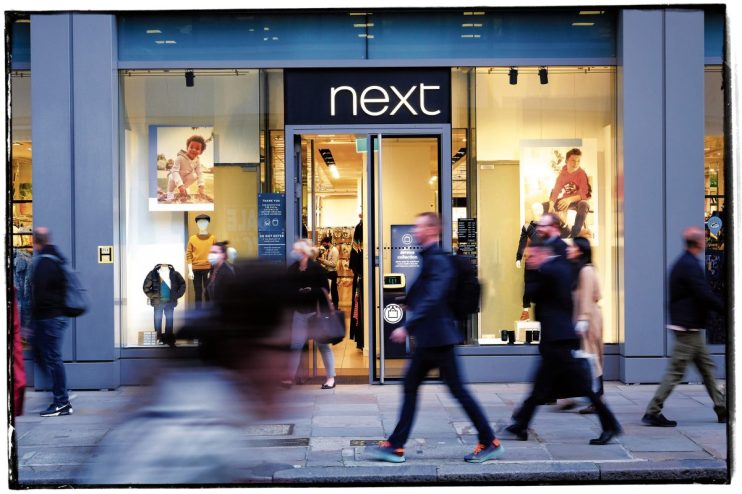 Next increased its full-year profit forecast by &pound;14m